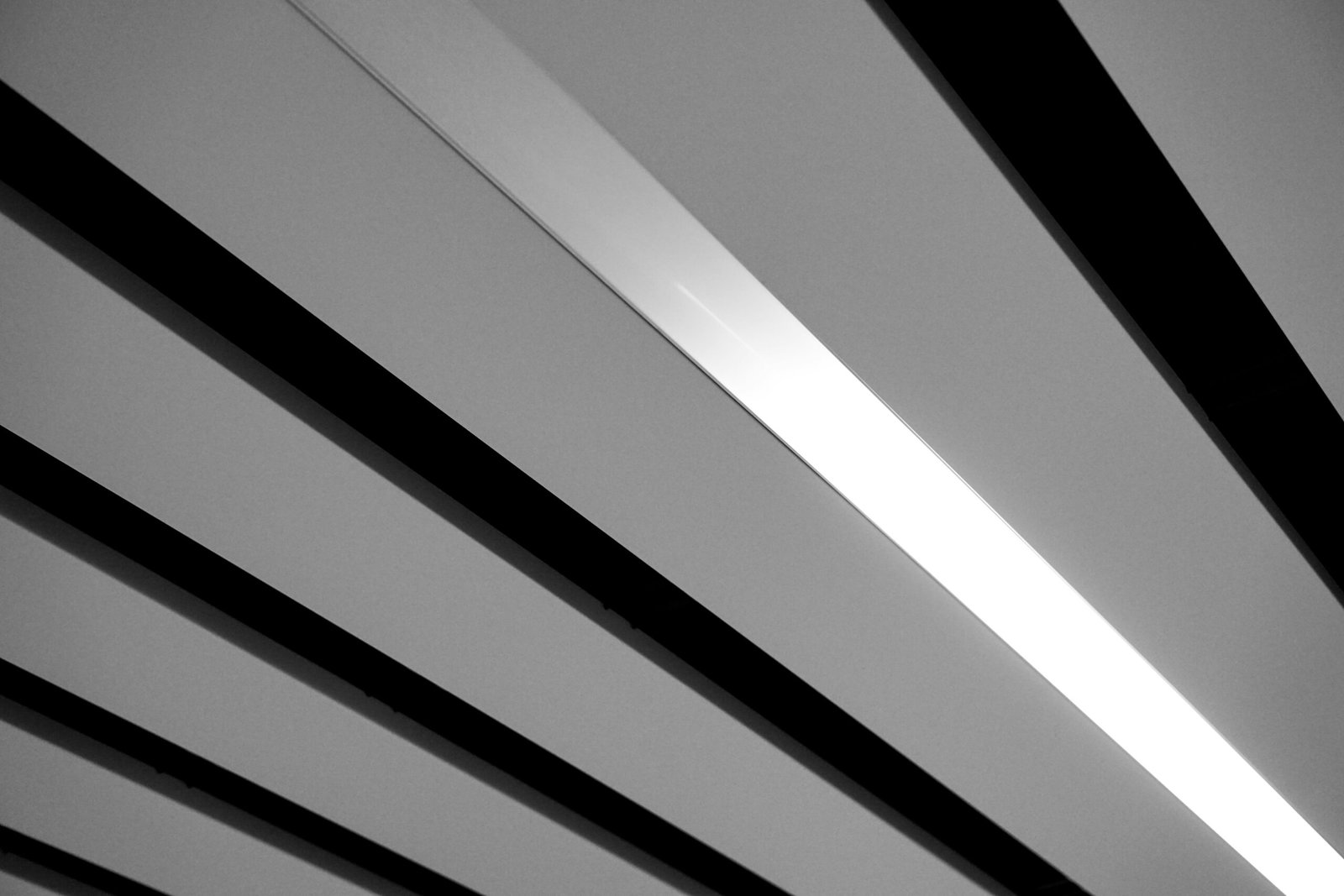 a black and white photo of a light fixture